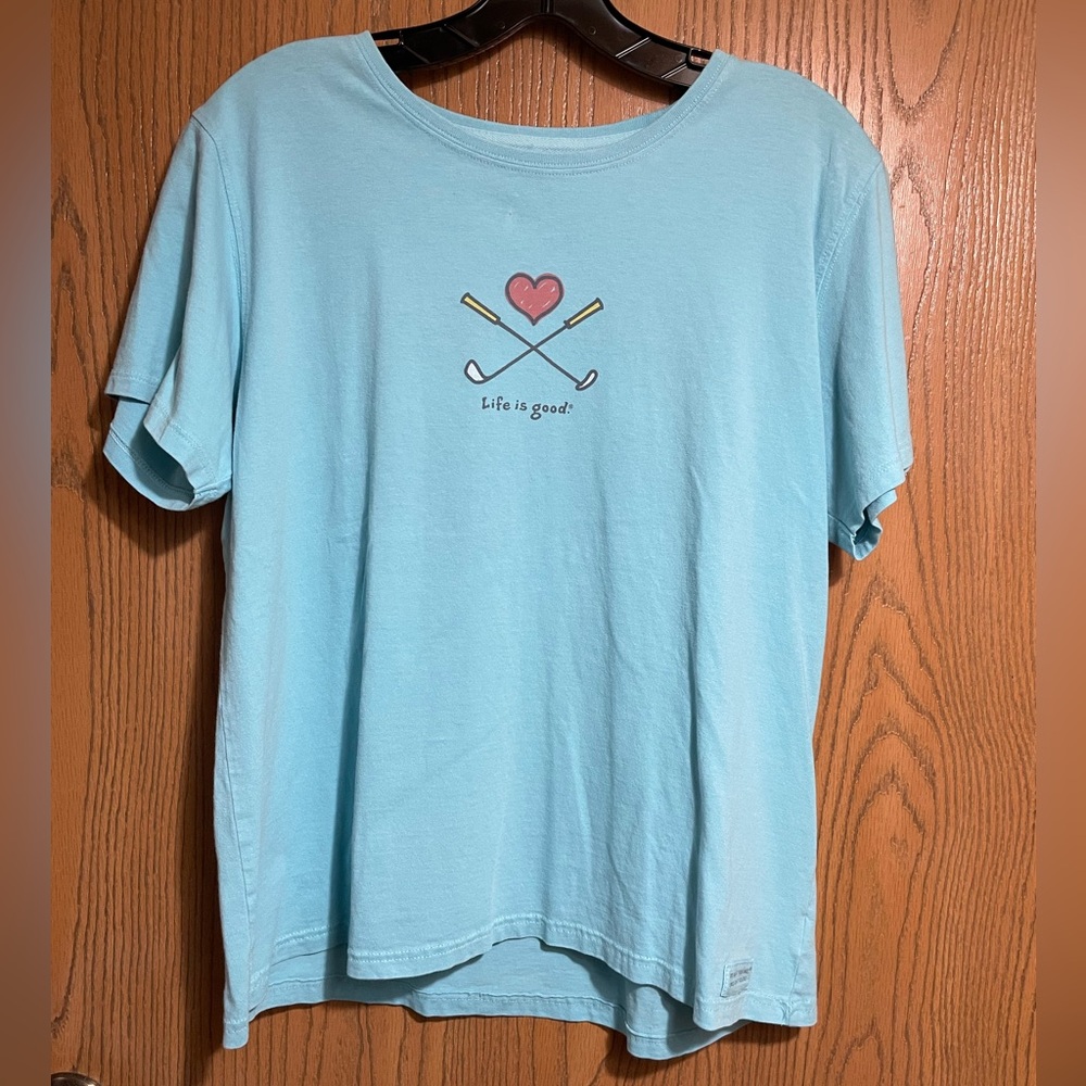 Life Is Good Golf Tee in Sky Blue Featuring a Heart and Golf Clubs